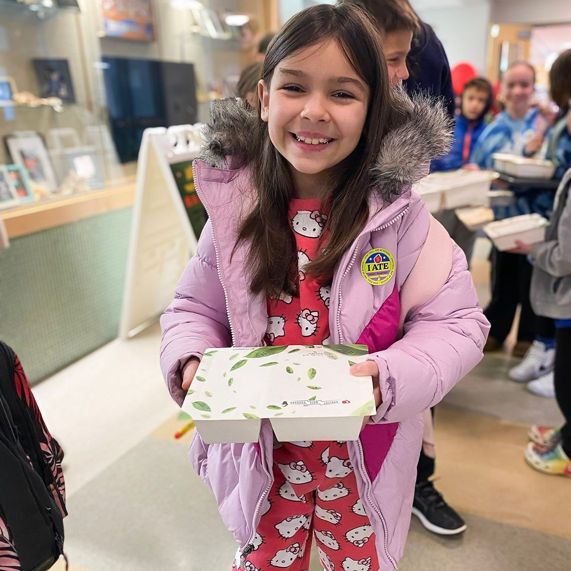 A student enjoys school breakfast.
