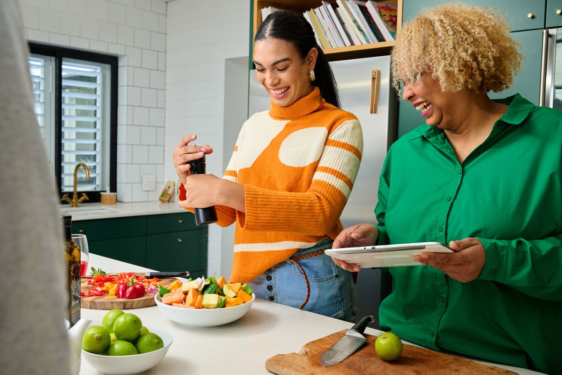 Two people are cooking a nutritious meal.