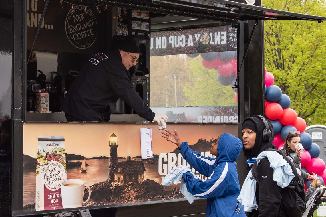 New England Coffee serves drinks to Walk for Hunger participants.